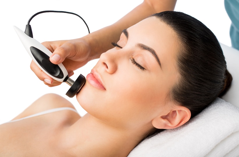 Young latin woman having a facial treatment