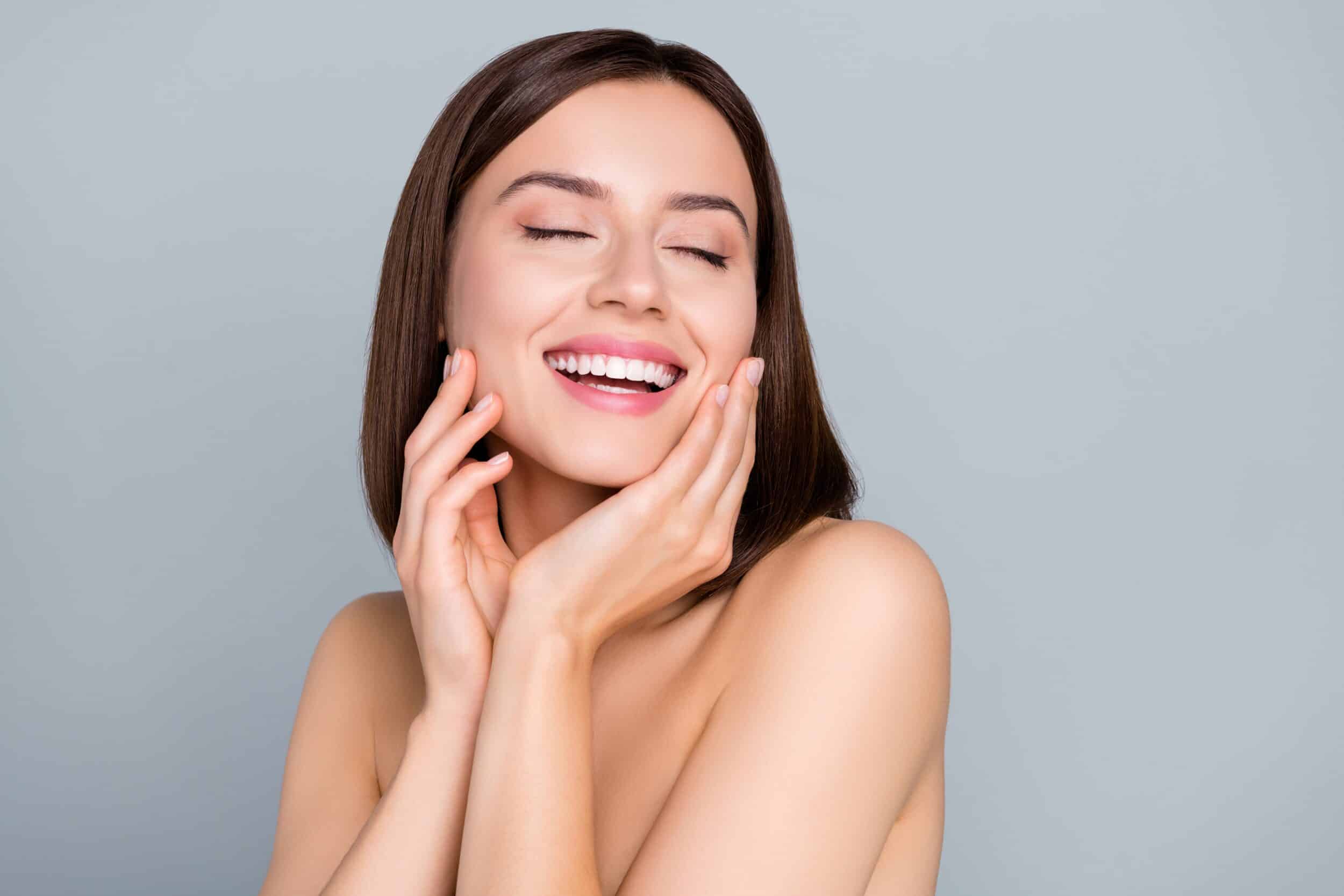Woman smiling with fresh, clear skin after IPL treatment in Whittier, CA